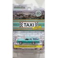GREEN LiGHT EXCLUSIVE 1/64 1991 Ford LTD Crown Victoria Wagon Rosarito Baja Taxi Teal with White Stripes