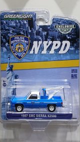 GREEN LiGHT EXCLUSIVE 1/64 1987 GMC Sierra K2500 with Drop in Tow Hook --New York City Police Dept (NYPD)